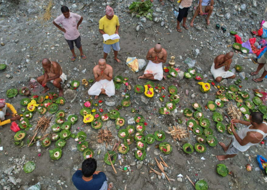 Nepal observes day of mourning for flood victims as families await news of missing relatives